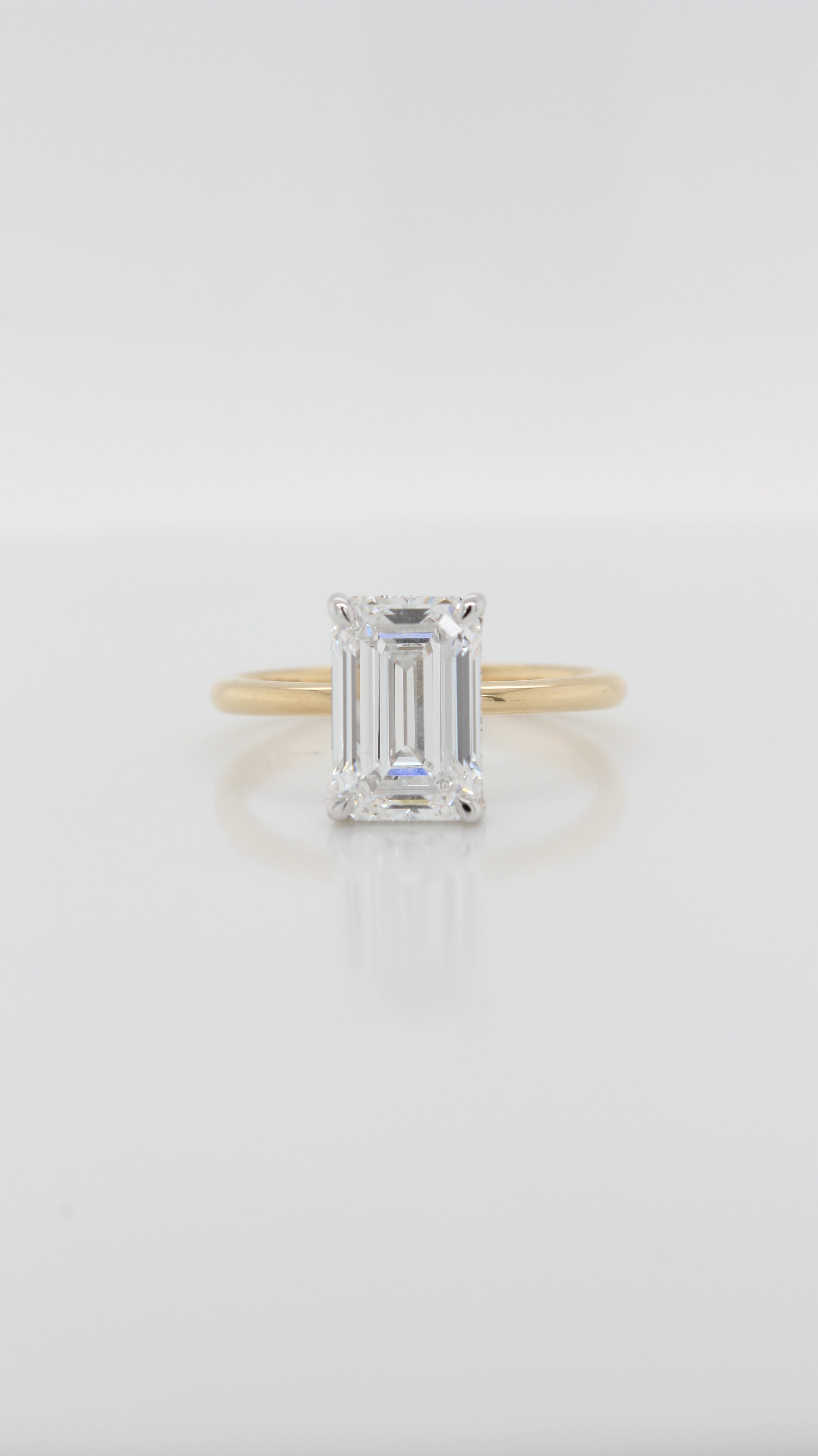 Emerald Cut Diamond in the Parker Classic Solitaire with Hidden Halo