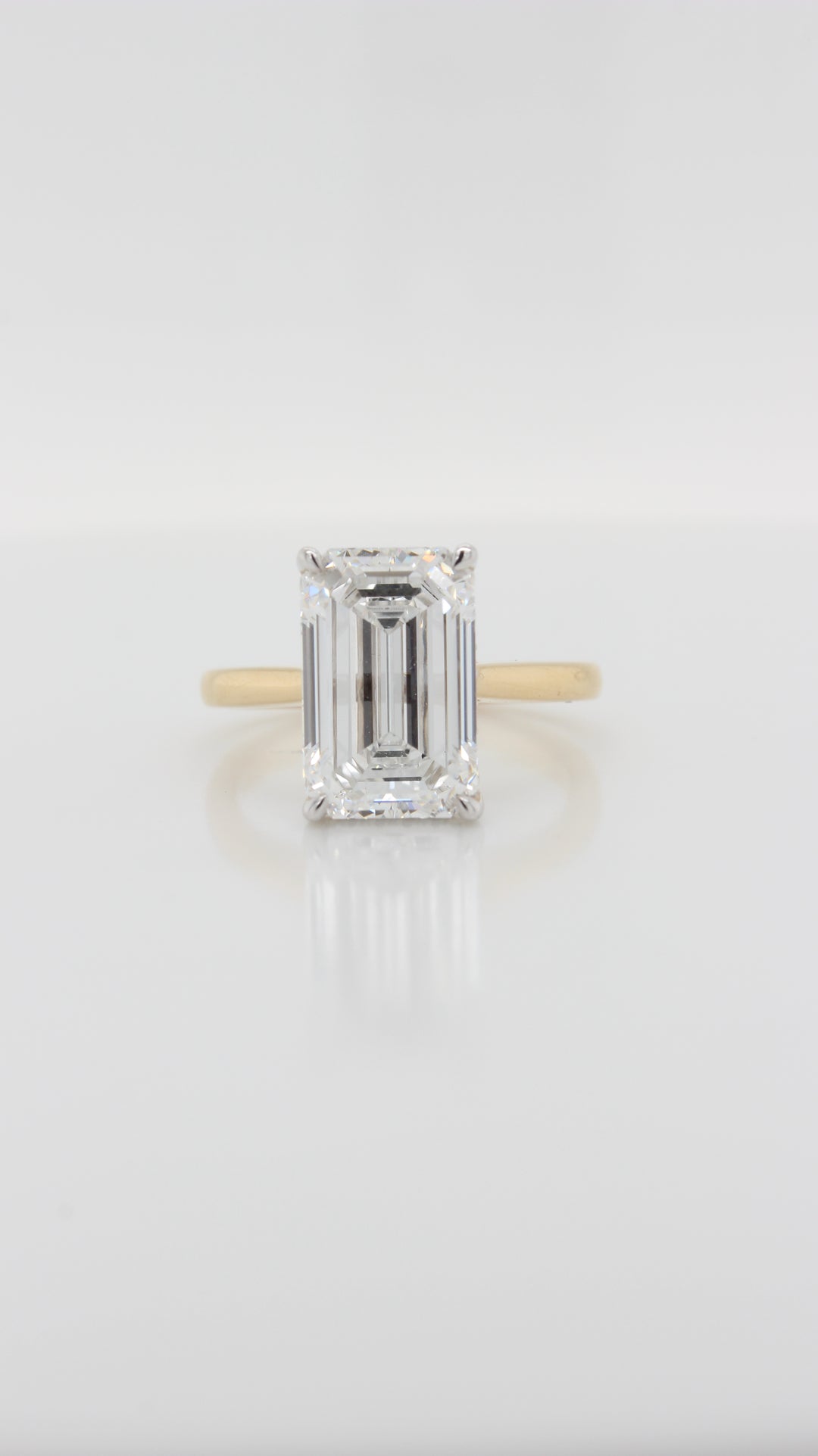 4.39ct Emerald Cut Diamond in our Parker Cathedral Solitaire with Hidden Halo