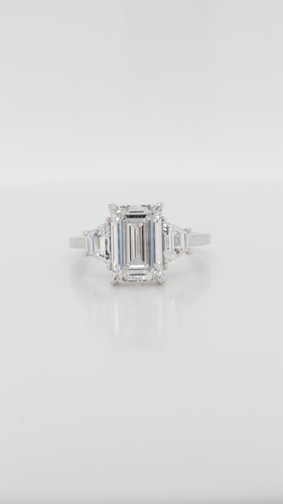 3.21ct Emerald Cut Diamond with Trapezoid Sides in the Trilogy Design with Hidden Halo