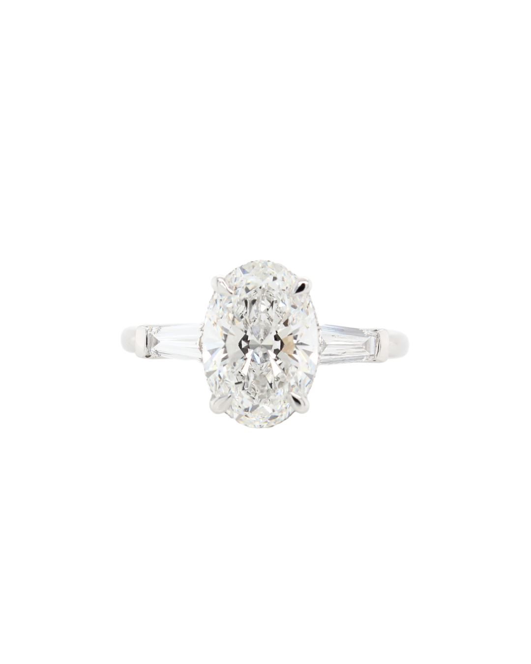 Oval Cut Diamond Trilogy Siena Design with 2 matching tapered Baguettes